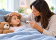 caring mom checks childs temperature