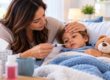 Parent checking a child’s temperature while monitoring fever symptoms at home